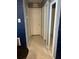 Hallway view showing multiple doorways and closets leading from a central hall at 22187 Lasalle Rd, Port Charlotte, FL 33952