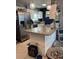 A kitchen with stainless steel appliances, a breakfast bar, granite counters, and white cabinets at 22187 Lasalle Rd, Port Charlotte, FL 33952