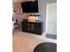 The living room includes a mounted TV and stylish cabinet with glass doors at 22187 Lasalle Rd, Port Charlotte, FL 33952