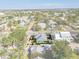 Well-maintained home with a pool, lush greenery, and a bright gray roof, nestled in a vibrant neighborhood at 233 Durrance St, Punta Gorda, FL 33950