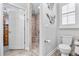 Bathroom featuring a walk-in shower, tile flooring, and neutral paint at 233 Durrance St, Punta Gorda, FL 33950