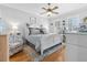 Comfortable primary bedroom featuring a queen bed, ceiling fan and wood floors at 233 Durrance St, Punta Gorda, FL 33950