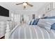 Comfortable primary bedroom with luxury bedding, tv, and an ensuite at 233 Durrance St, Punta Gorda, FL 33950