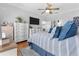 Comfortable primary bedroom with luxury bedding, tv, and an ensuite at 233 Durrance St, Punta Gorda, FL 33950