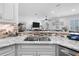 Bright kitchen with granite countertops, stainless steel appliances, and an open view to the living area at 233 Durrance St, Punta Gorda, FL 33950