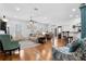 Bright and airy living room with wood floors, comfortable seating, and a view of the dining area at 233 Durrance St, Punta Gorda, FL 33950