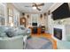 Cozy living room featuring a fireplace, hardwood floors, and comfortable seating at 233 Durrance St, Punta Gorda, FL 33950