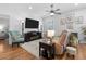 Cozy living room with a large TV, comfortable seating, and decorative lamps for a relaxed atmosphere at 233 Durrance St, Punta Gorda, FL 33950