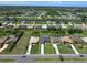 Wide aerial shot showcases the property with a pool and surrounding neighborhood at 260 Rotonda E Blvd, Rotonda West, FL 33947