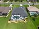 Aerial view of the home featuring a screened pool and meticulously landscaped yard at 260 Rotonda E Blvd, Rotonda West, FL 33947