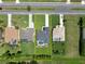 Aerial view of the home with a pool and spacious yard, enclosed by yellow property line markers at 260 Rotonda E Blvd, Rotonda West, FL 33947