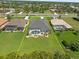 Aerial view shows the property lines, a screened pool and patio, and the surrounding neighborhood at 260 Rotonda E Blvd, Rotonda West, FL 33947