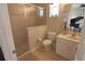 Tiled bathroom featuring a shower, toilet, sink, and piano at 260 Rotonda E Blvd, Rotonda West, FL 33947