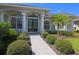 Inviting home entrance featuring a beautifully landscaped walkway leading to an elegant double door entry at 260 Rotonda E Blvd, Rotonda West, FL 33947
