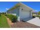 Attached two-car garage featuring decorative column supports and ample parking space at 260 Rotonda E Blvd, Rotonda West, FL 33947