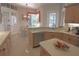 Kitchen featuring tile floors, wood cabinets, stainless steel appliances, and a center island with seating at 260 Rotonda E Blvd, Rotonda West, FL 33947