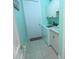 Bright laundry room featuring a washer, dryer, sink, and ample cabinet space for storage at 260 Rotonda E Blvd, Rotonda West, FL 33947