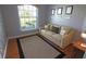 Cozy living room with neutral sofa, decorative pillows, area rug, and natural light at 260 Rotonda E Blvd, Rotonda West, FL 33947
