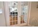 Bright room featuring beautiful hardwood floors, a grand piano and a comfortable chair at 260 Rotonda E Blvd, Rotonda West, FL 33947