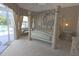 Bright main bedroom with a four-poster bed, sitting area, and views of the pool at 260 Rotonda E Blvd, Rotonda West, FL 33947