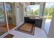 Outdoor kitchen features a grill, sink, and counter space with view of pool at 260 Rotonda E Blvd, Rotonda West, FL 33947
