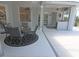 Screened in patio with table and chairs offers easy access to the backyard at 260 Rotonda E Blvd, Rotonda West, FL 33947