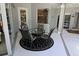 Screened in patio with table and chairs, perfect for enjoying the outdoors at 260 Rotonda E Blvd, Rotonda West, FL 33947