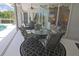 Relaxing patio space with stylish furniture, ceiling fan and view of the pool at 260 Rotonda E Blvd, Rotonda West, FL 33947