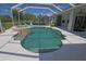 Beautiful pool area featuring a spa, sun loungers and screened enclosure at 260 Rotonda E Blvd, Rotonda West, FL 33947
