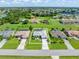 Aerial view of the property showcasing the house, pool, and surrounding neighborhood at 26090 Rampart Blvd, Punta Gorda, FL 33983