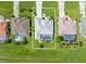 Overhead view of property showing the house layout, green lawn, and adjacent neighborhood homes at 26090 Rampart Blvd, Punta Gorda, FL 33983