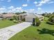 Charming single-story home with a well-manicured lawn, beautiful landscaping and a two car garage at 26090 Rampart Blvd, Punta Gorda, FL 33983