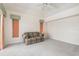 Large living room features neutral colors, an exterior window, and comfortable seating at 26090 Rampart Blvd, Punta Gorda, FL 33983