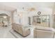Inviting living room with tile floors, designer furniture, and a view of the front entrance at 26090 Rampart Blvd, Punta Gorda, FL 33983