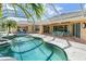 Inviting screened-in pool with comfortable seating, perfect for outdoor relaxation and entertainment at 26090 Rampart Blvd, Punta Gorda, FL 33983