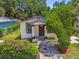 Aerial front exterior of the house showing landscaping and entry at 2626 E 38Th Ave, Tampa, FL 33610
