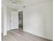 This bedroom features laminate flooring, a ceiling fan, and an open doorway at 2626 E 38Th Ave, Tampa, FL 33610