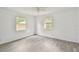 Bedroom showcasing natural light, ceiling fan and neutral gray flooring at 2626 E 38Th Ave, Tampa, FL 33610