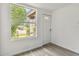 A bright entryway has a large window, neutral walls, vinyl floors, and a clean, welcoming aesthetic at 2626 E 38Th Ave, Tampa, FL 33610
