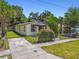 Exterior view of the home showing nice landscaping at 2626 E 38Th Ave, Tampa, FL 33610