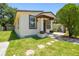 Exterior view of a home with a well-kept lawn and front porch at 2626 E 38Th Ave, Tampa, FL 33610