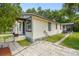 Exterior view of a home with a well-kept lawn and off-street parking at 2626 E 38Th Ave, Tampa, FL 33610