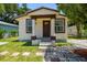 Charming single-Gathering home with a cozy front porch and well-maintained lawn at 2626 E 38Th Ave, Tampa, FL 33610