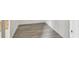 Hallway featuring neutral paint, and light gray laminate flooring at 2626 E 38Th Ave, Tampa, FL 33610