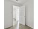 Hallway featuring neutral paint, and light gray laminate flooring at 2626 E 38Th Ave, Tampa, FL 33610