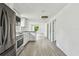 Spacious kitchen with stainless steel appliances and an open floor plan at 2626 E 38Th Ave, Tampa, FL 33610