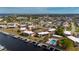 Aerial view of waterfront condo community showcasing boat docks, a pool, manicured landscaping, and convenient parking at 311 Garvin St # 301B, Punta Gorda, FL 33950