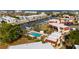 Waterfront condo community aerial view showcasing a pool, boat docks, and lush landscaping with great water access at 311 Garvin St # 301B, Punta Gorda, FL 33950