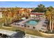 A high angle, sunny view of the community pool surrounded by condos at 311 Garvin St # 301B, Punta Gorda, FL 33950