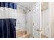 Full bathroom featuring a tub with shower and adjacent linen closet at 311 Garvin St # 301B, Punta Gorda, FL 33950